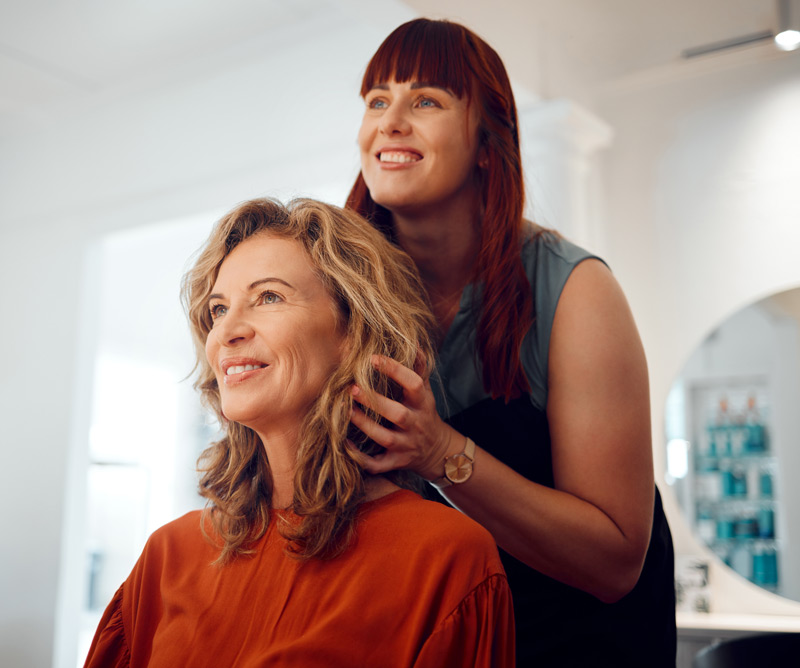 A hair stylist with customer